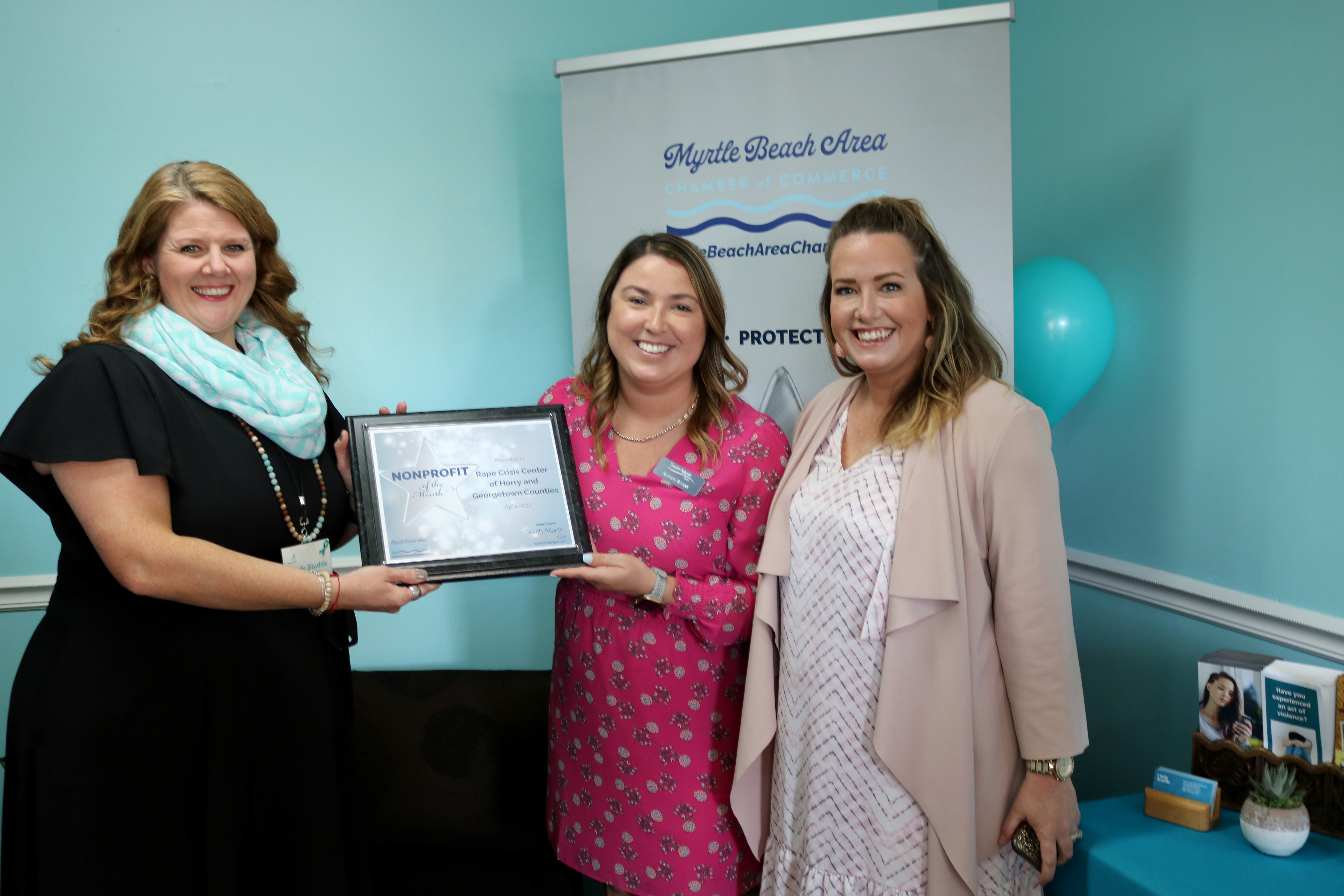 South Atlantic Bank gives award plaque to rape crisis center