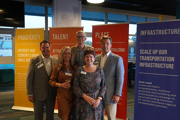 Dr. Michael Benson, Clay Brittain, Alex Husner, Karen Riordan and Ryan Swaim pose for photo at PGS victory celebration.