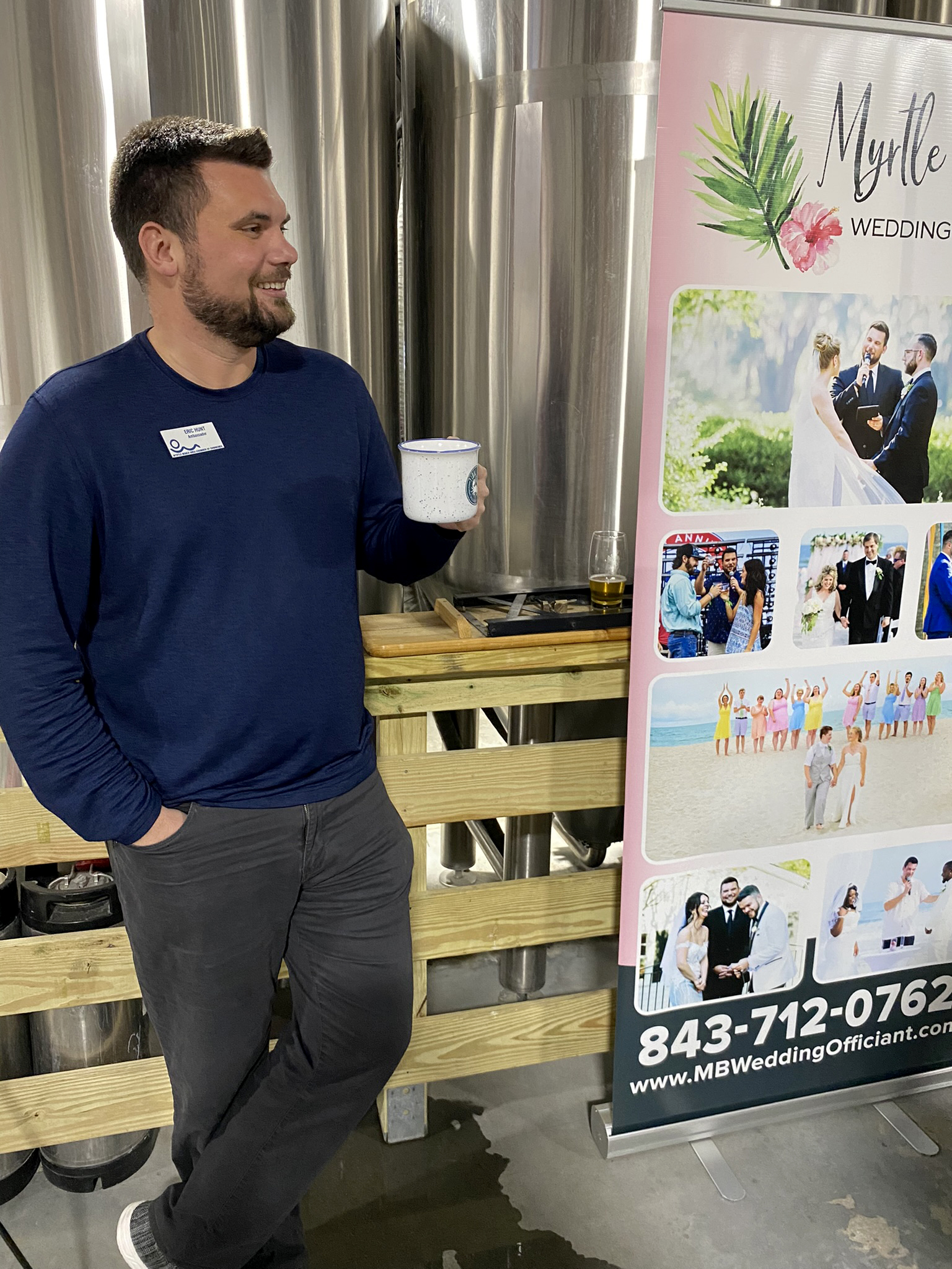 Eric Hunt holds a coffee mug at Tidal Creek Brewhouse