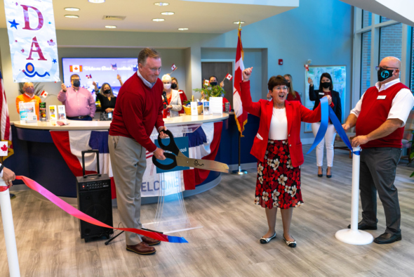 Bill Golden and Karen Riordan celebrate cutting a ribbon