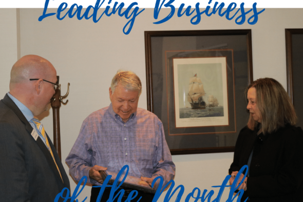 don leonard receiving plaque for leading business of the month