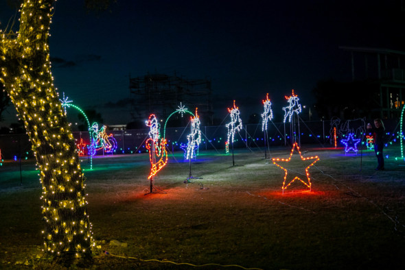 twinkle lights make the shapes of santa in a sleigh and reindeer