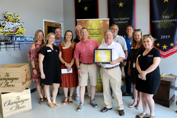 Yahnis Company and chamber employees pose for photo